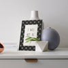 Decoarative Mini Print on a bookshelf