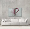 Love sample canvas art on a wall with sofa